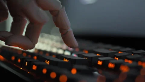 In a futuristic programming lab a robotic arm efficiently presses keys on a 스톡 동영상 331475388
