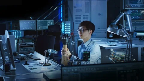 Futuristic Prosthetic Robot Arm Being Tested by Professional Japanese Developer Stock Footage 105354654