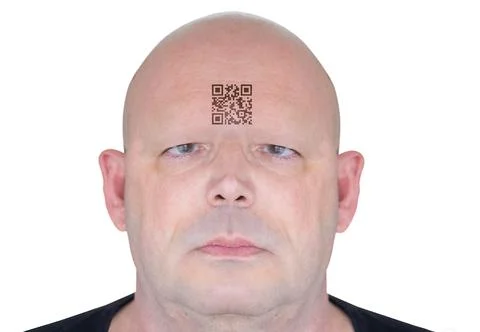 Futuristic rendering of a man's face with a QR code on his forehead. Conceptual  Stock Photos