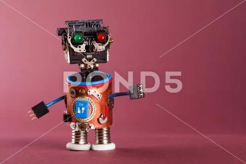 Futuristic robot concept. Funny toy mechanism, black plastic head, colored green Stock Photos