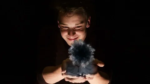Futuristic scene of a man with cupped hands opening a portal. Stock Footage 110285982