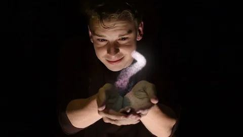 Futuristic scene of a man with cupped hands with a magical spiral Stock Footage 110324320