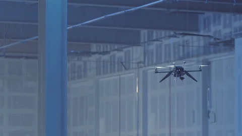 Futuristic sci-fi delivery drone flies inside giant warehouse - slow motion v3 Stock Footage 106711393