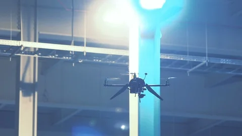 Futuristic sci-fi delivery drone flies inside giant warehouse - slow motion v4 Stock Footage 106711420