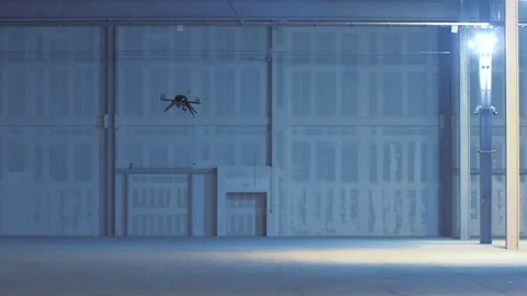 Futuristic sci-fi delivery drone flies inside giant warehouse - slow motion v5 Stock Footage 106711439