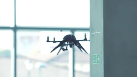 Futuristic sci-fi drone flies and scans office building interior CU 4 Stock Footage 106393260