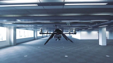 Futuristic sci-fi drone flies and scans huge empty office Stock Footage 106395692