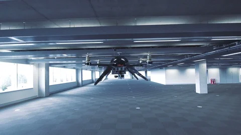 Futuristic sci-fi drone flies and scans huge empty office v2 Stock Footage 106395961