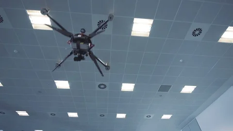 Futuristic sci-fi drone flies and scans huge office interior v2 Stock Footage 106396041