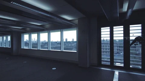 Futuristic sci-fi drone flies inside in front of window with London view WIDE V2 Stock Footage 106396517