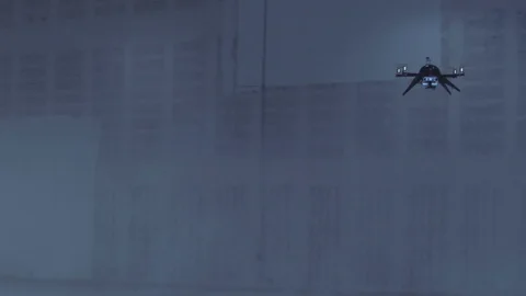 Futuristic sci-fi drone flies and scans huge empty warehouse as lights flicker Stock Footage 106710525