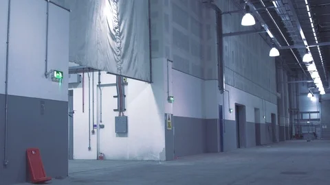 Futuristic sci-fi drone flies past while inspecting warehouse v2 Stock Footage 106710844