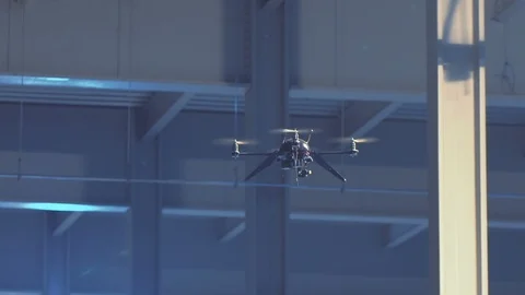 Futuristic sci-fi drone flies high in industrial warehouse Stock Footage 106711580