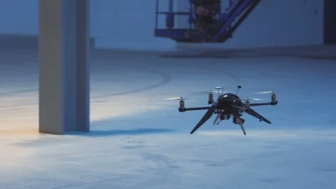 Futuristic sci-fi drone hovers inside industrial factory Stock Footage 106711693