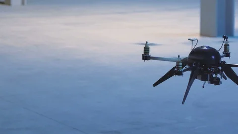 Futuristic sci-fi drone scans inside industrial building Stock Footage 106711970