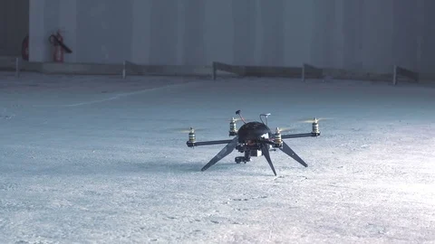Futuristic sci-fi drone takes off inside huge empty warehouse - dust cloud Stock Footage 106710632