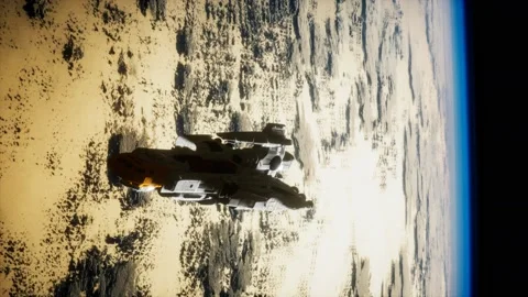 Futuristic spaceship near the Earth. Elements of this image furnished by NASA 库存影片 129724188