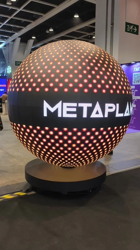 Futuristic spherical display installation glowing with warm orange LED lights Stock Footage 344320566