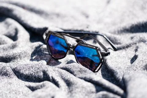 Futuristic sunglasses design with big green lenses closeup shoot outside in a Stock Photos