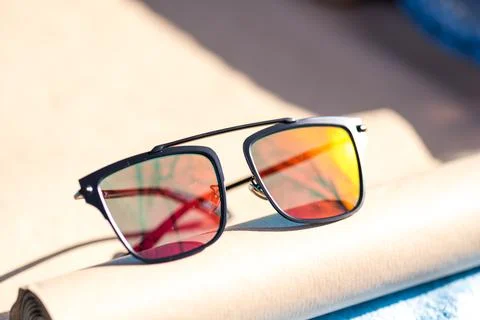 Futuristic sunglasses design with big red flat lenses closeup shoot outside in a Stockfoto's