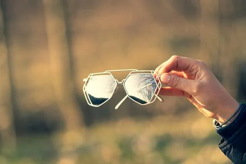 Futuristic sunglasses model having a special design with big silver lenses Stock Photos