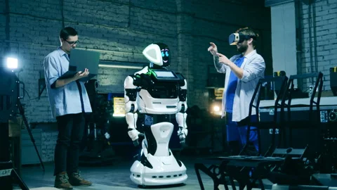 Futuristic technology concept. Factory workers using VR to test a robot. Future Video stock 150030128