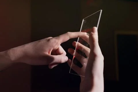Futuristic Transparent Smartphone Interface Concept in Human Hands Foto stock