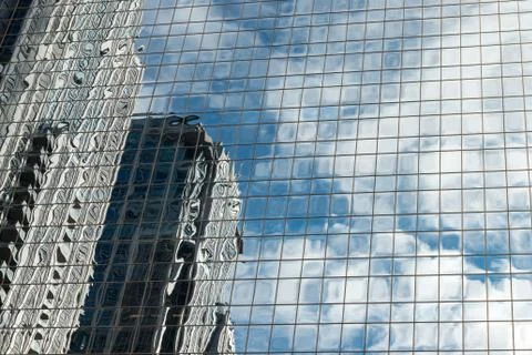 Futuristic view of glassy skyscraper walls reflected in each other Stock Photos