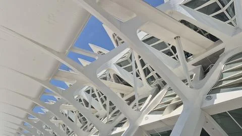 Futuristic white architectural structure against blue sky Stock Photos