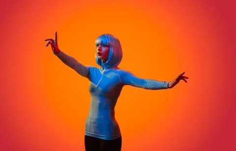 Futuristic woman interacting with invisible screen Stock Photos