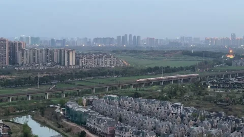 Fuxing High Speed Bullet Train Passing Above Luxury Villa District in Chengd Stock-Footage 334696901