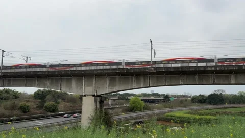 Fuxing High Speed Train Crossing Highway Overpass in Chengdu China Stock Footage 334698304