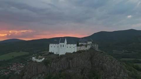 Füzér Castle above forests in Hungary's Zemplén Mountains at cloudy dusk Stock Footage 340106840