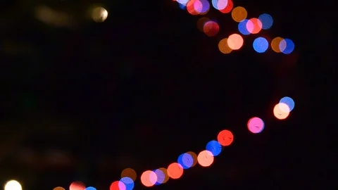 Fuzzy colorful lights of garlands of multi-coloured light flashing. Stock Footage 120146041