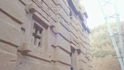 Fwd Low Angle View Tilt Up Side Facade Bet Amanuel Church Lalibela Ethiopia Stock Footage 125971842