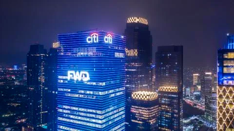 FWD tower with surrounding buildings at night time Stock Photos