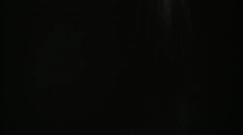 FX Steady Dust Snow Particles Fall Against Black Background Stock-Footage 12635675