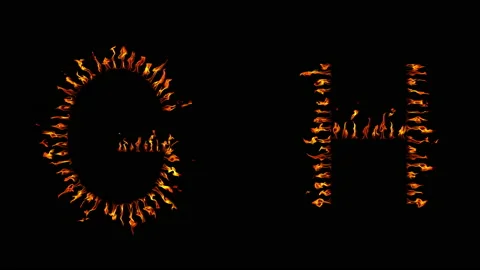 G H text. real fire flaming in slow motion. Stock Footage 143682392