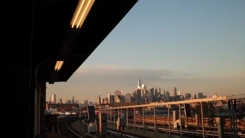 G train pulls into Smith and 9th Street subway station overlooking New York Stock-Footage 98648692