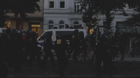 G20 Summit 2017: Night Crowds of Demonstrators and Police Groups in Hamburg_4K Stock Footage 315396695