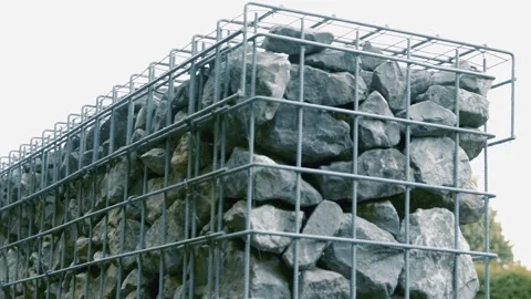 Gabion structure showcasing durable design and natural stone materials in c.. Stock Footage 310999943