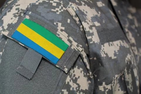 Gabon army uniform patch flag on soldiers arm. Military Concept Stock Photos