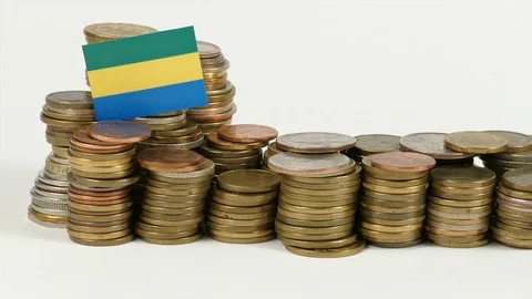 Gabon flag waving with stack of money coins Stock Footage 71929667