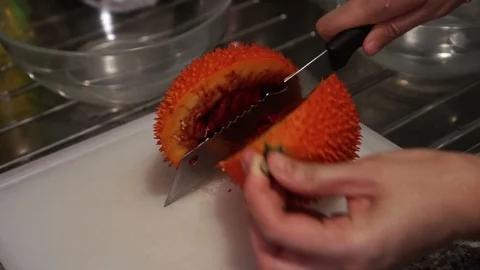 Gac fruit cut open, red healthy antioxidant food video Stock-Footage 94259387