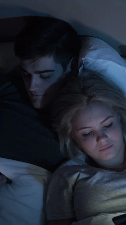 Gadget night bored couple using phones vertical Stock Footage 229782735