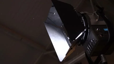 Gafer adjusts the lights on the set before shooting the video Stock Footage 148409471