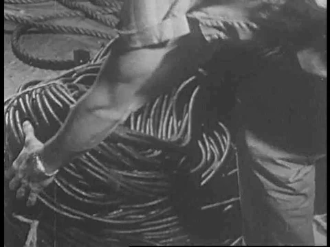 A gaffer connects cables to an electric panel on for a theatre play in the Stock Footage 75188321