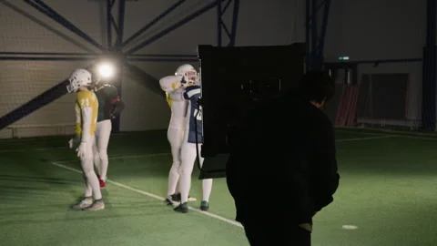 Gaffer Setting up Lights on Set of American Football Show at Arena Stock Footage 335387421