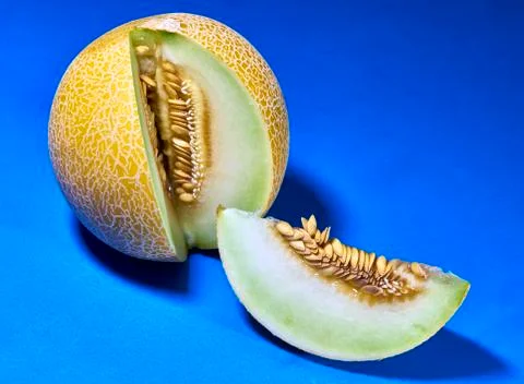 Gaia melon slice on blue background Photos