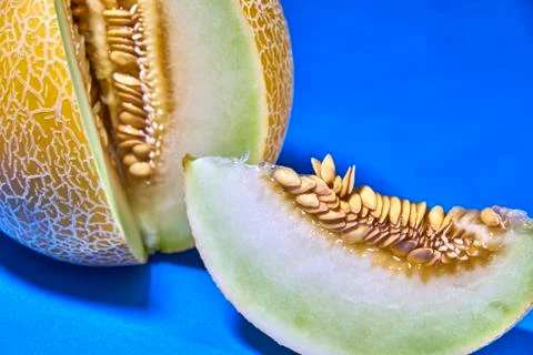 Gaia melon slice on blue background Photos